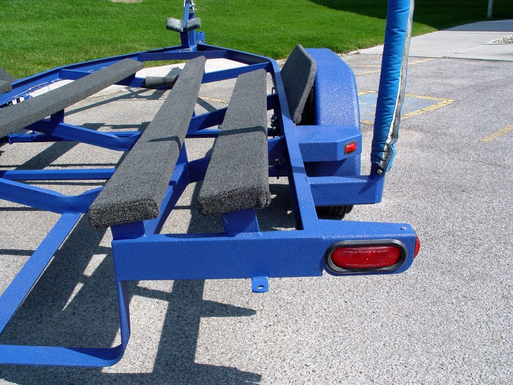Trailer manufacturing with high-performance spray coatings