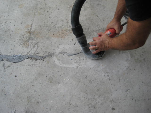 man sanding a cu-500cr concrete repair